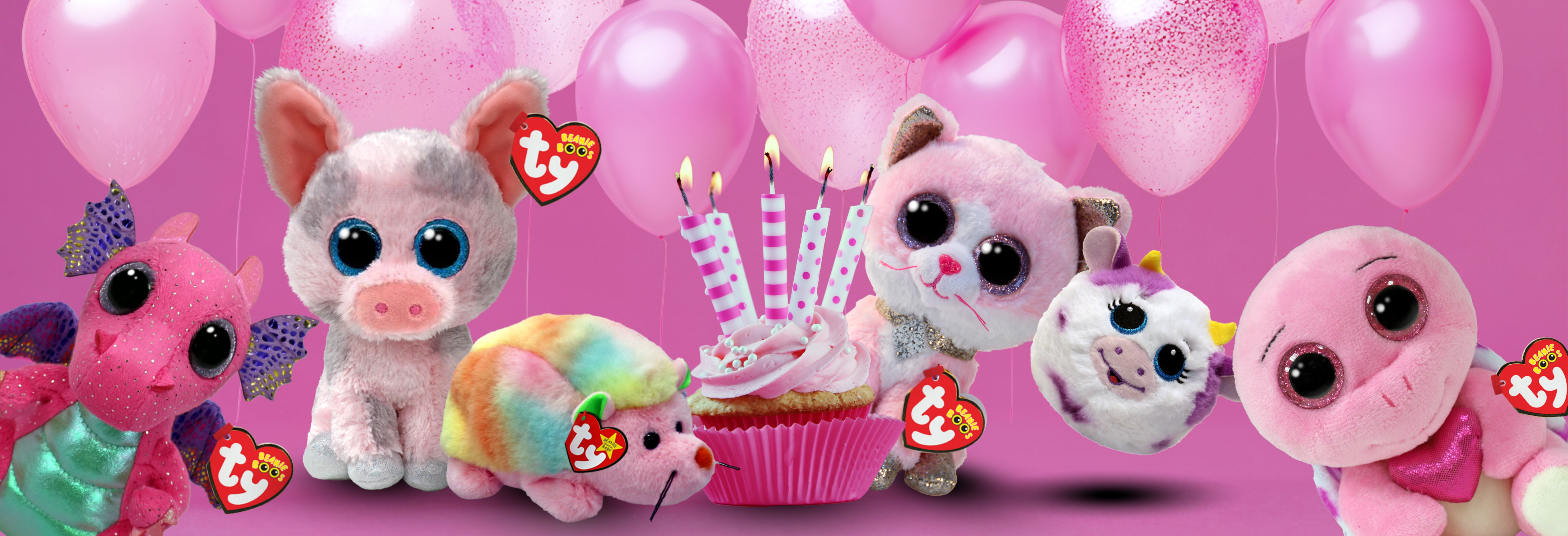 pink beanies posing with cupcake